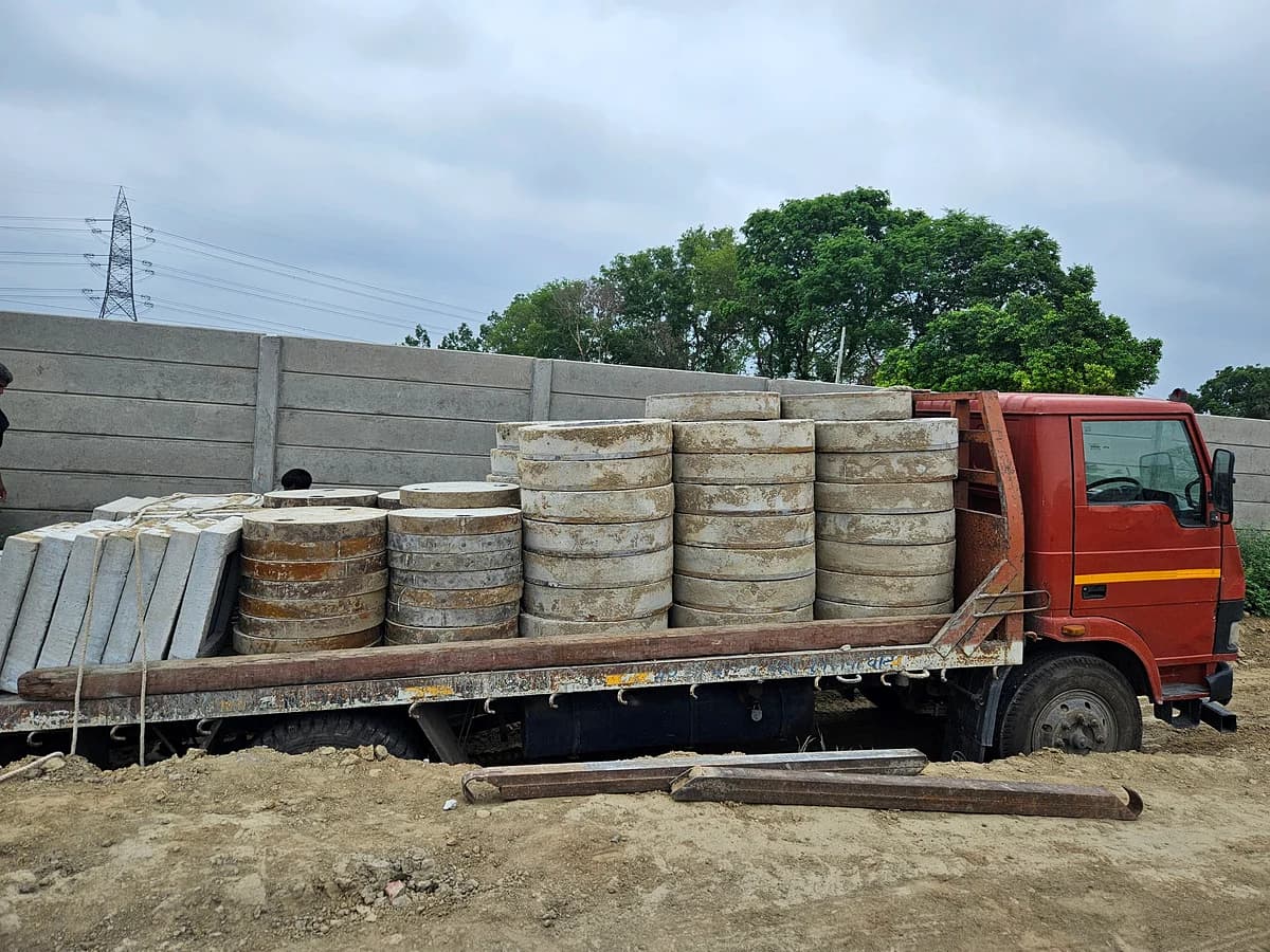 Truck loaded with precast concrete manhole rings and slabs ready for dispatch